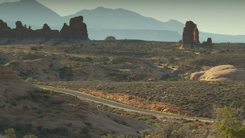 Arches National Park wide shot with RV passing through