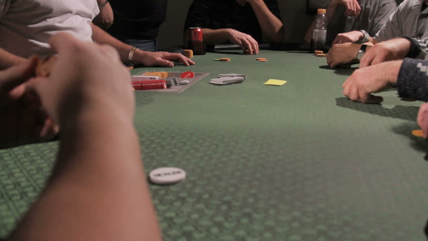 A full table of gamblers playing blackjack