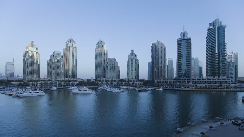 a transition shot of Dubai Marina, a modern Development set amidst the futuristic Skyline of a modern Middle East Country, Dubai,