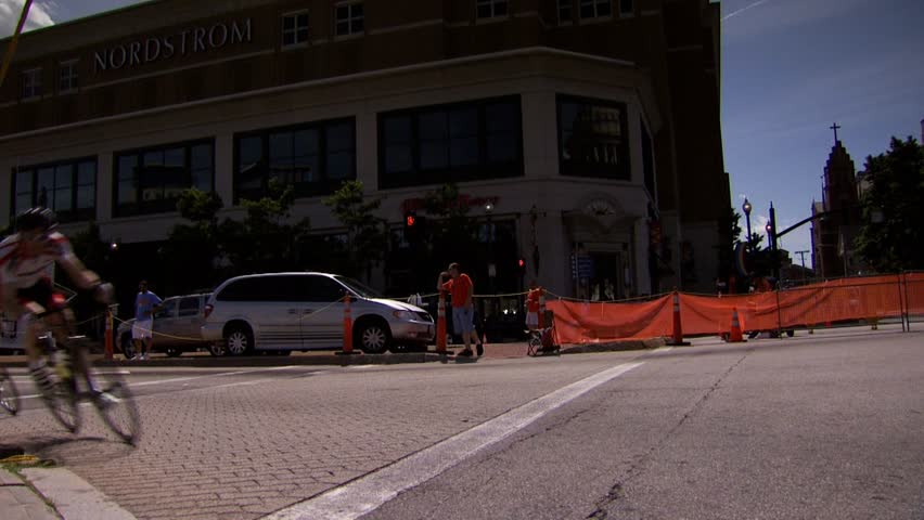 PROVIDENCE, RHODE ISLAND - SEPTEMBER 3, 2009: Bicycle racers passing camera in tight corner - slow motion