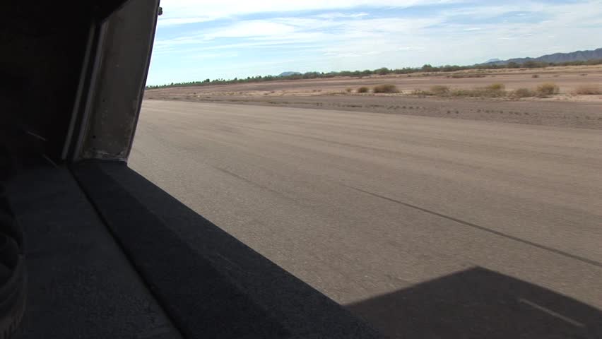 View of Runway From A Prop Plane Moving Down The Runway 
