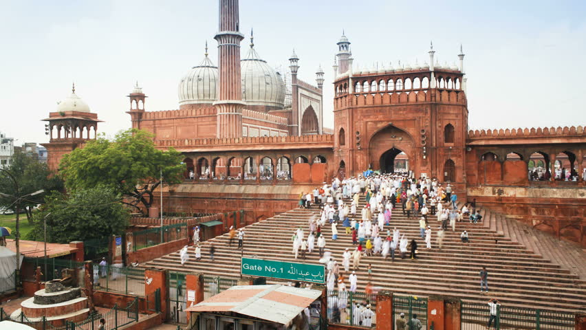 OLD DELHI, INDIA - CIRCA MAY 2011: People leaving the Jama Masjid (Friday Mosque) after the Friday Prayers