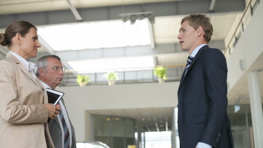 Enthusiastic young man being ready to cooperate with his mature associates