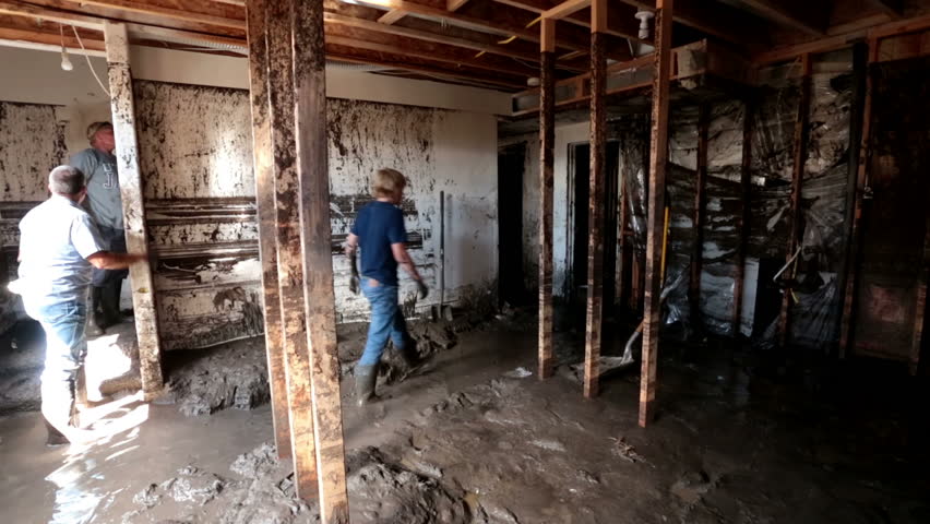 FOUNTAIN GREEN, UTAH 30 JUL 2012: Home house flood debris with water and mud from flash flood. Wildfire burned all vegetation rain caused surge of muddy ash water that completely filled the home.