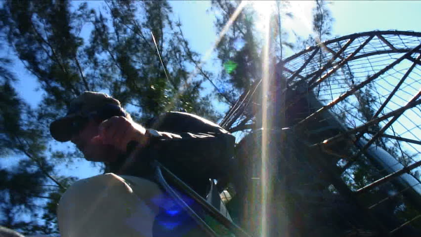 low angle air-boat captain in sun