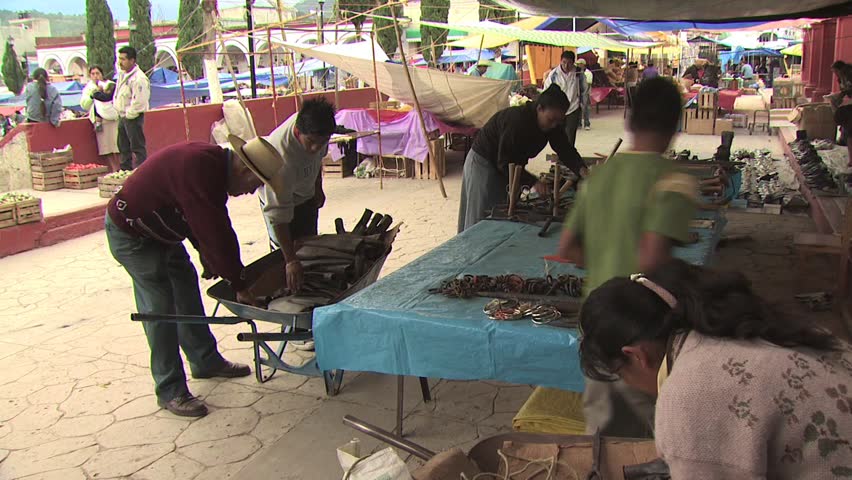 MEXICO CITY - CIRCA 2010: Mexican Vendors Set Up Merchandise