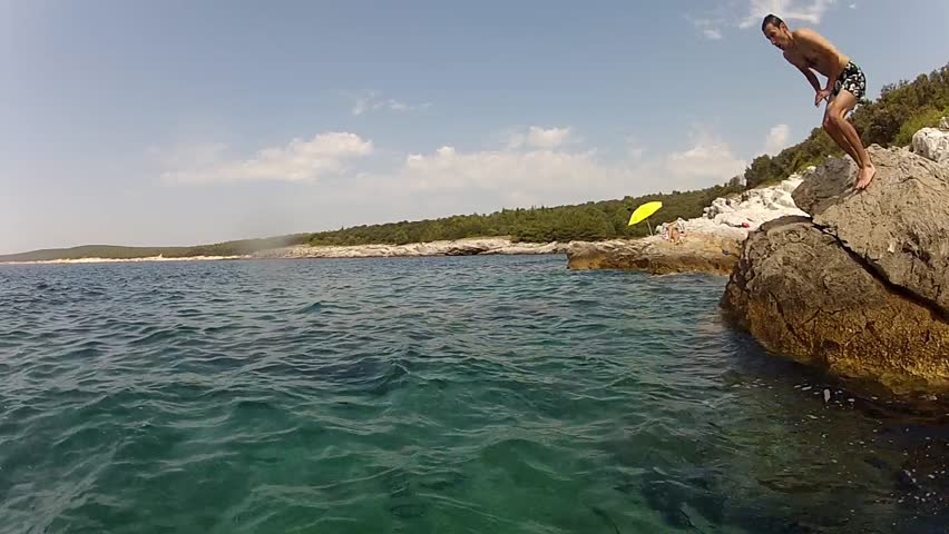 Man plunging in the water - slow motion