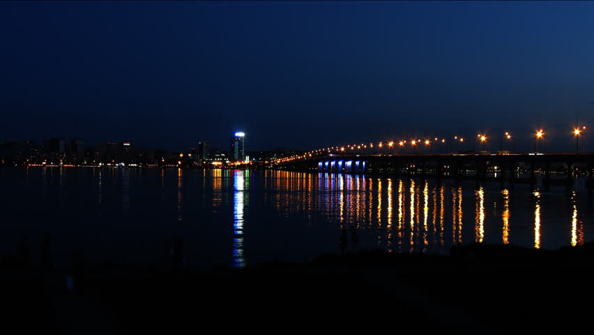 Dnepropetrovsk night city scape over Dnieper river time lapse