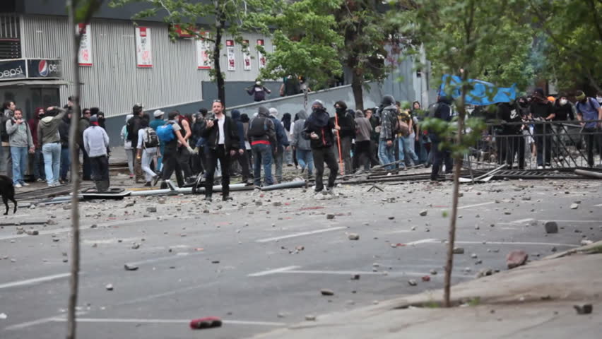 SANTIAGO, CHILE - OCTOBER 06: Chilean riot disperse protesters during a student strike on October 6, 2011 in Santiago, Chile. Protesters demand the government to improve education quality
