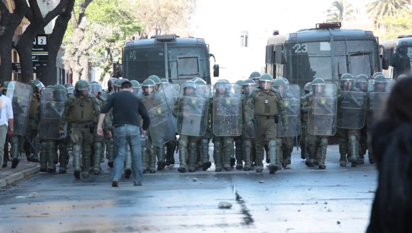 SANTIAGO, CHILE - OCTOBER 06: Chilean riot disperse protesters during a student strike on October 6, 2011 in Santiago, Chile. Protesters demand the government to improve education quality