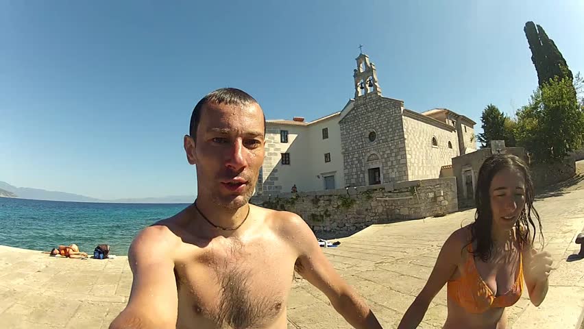 Couple jumping in the water