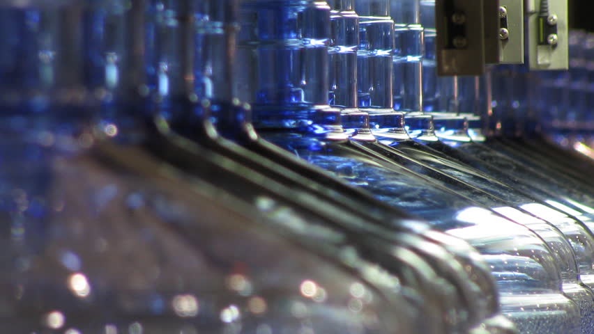 Bottled water factory. Production line. Time lapse, loopable.