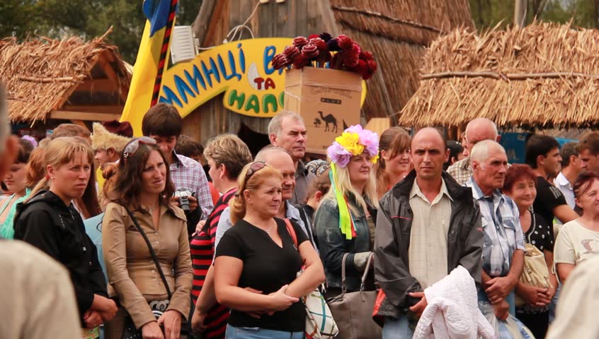 VELYKI SOROCHYNTSI, UKRAINE - AUGUST 17: Crowds watch a performance at the Sorochyntsy Fair on August 17, 2012 in Velyki Sorochyntsi, Ukraine. This large fair has been held every year since the end of Soviet rule and was declared Ukraine's national trade 