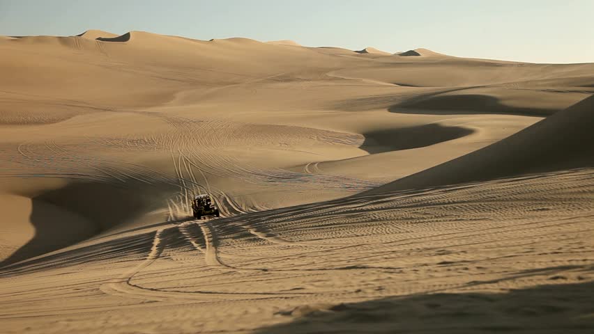 video footage of driving with a buggy off-road in the dunes of Ica, Peru