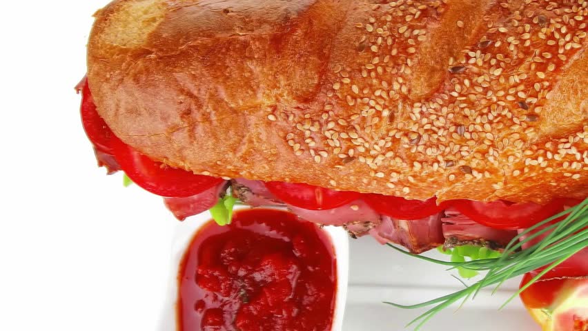 sandwich : french baguette with smoked sausage on white plate isolated over white background