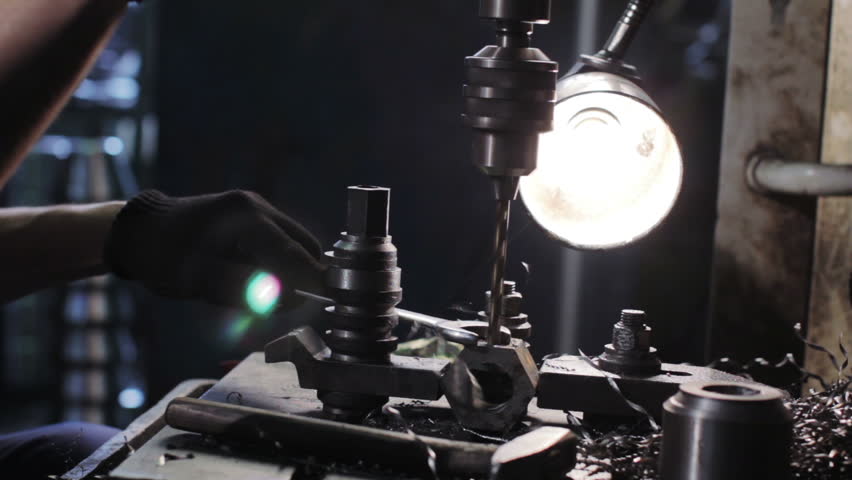 Drilling machine drills metal part