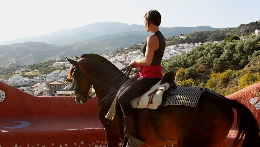 Woman riding a horse in Andalusia, Spain