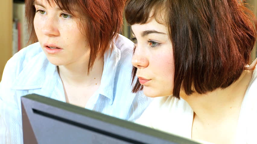 Young Caucasian students group at university workshop e-learning