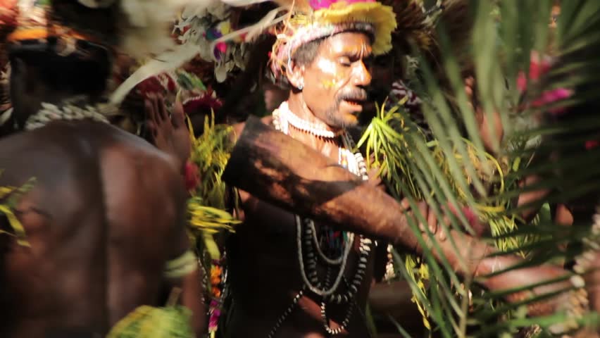 TUFI, PAPUA NEW GUINEA - APRIL 8: Elaborate and detailed traditional costumes adorned with feathers, flowers and shells are worn by traditional dancers on April 8, 2011 in Tufi, Papua New Guinea.