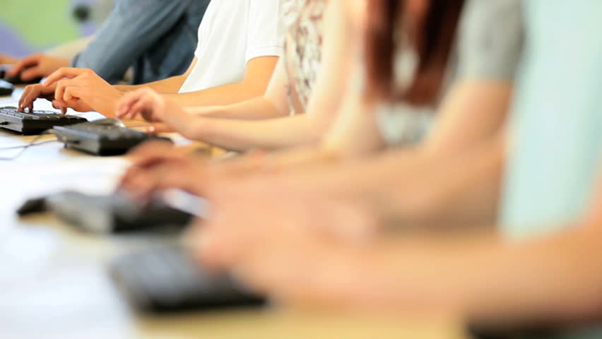 Caucasian female tutor instruct young college students researching knowledge in technology IT room