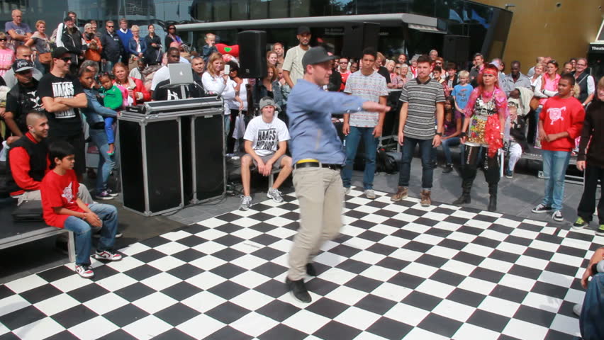 THE HAGUE, HOLLAND - AUGUST 30: Boy dances on an outdoor dance floor at Out Festival in The Hague, Holland on August 30, 2012. The Out Festival is an annual cultural festival in The Hague.