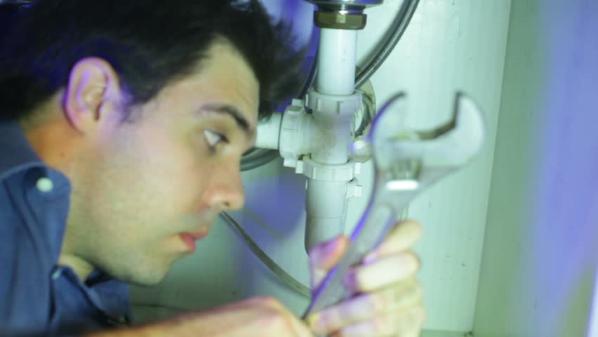 Plumber, working on pipes