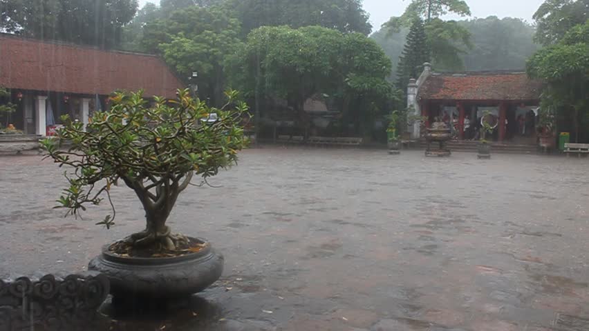 HANOI, VIETNAM - AUGUST 8: Temple of literature during a monsoon rain on August 8, 2012 in Hanoi, Vietnam
