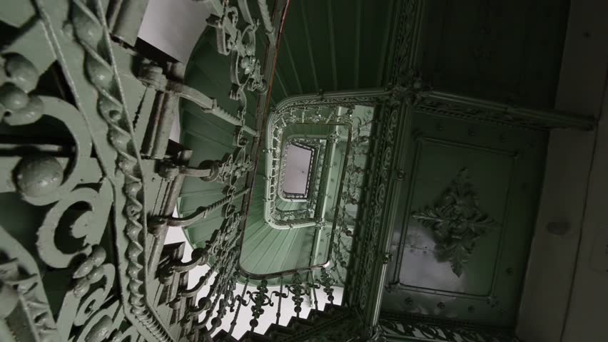 Grunge, old green staircase in abandoned building