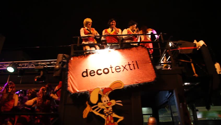 LAS PALMAS DE GRAN CANARIA, SPAIN - FEBRUARY 18: 200,000 masked revelers and a hundred or so festooned cars and floats in the Grande Parade (Gran Cabalgata ) of the Carnival February 18, 2012, Spain 