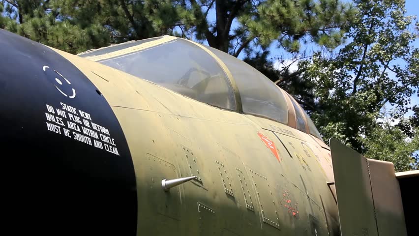 Closeup Of Old Fighter Airplane Canopy And Fuselage With Shifting Sunlight