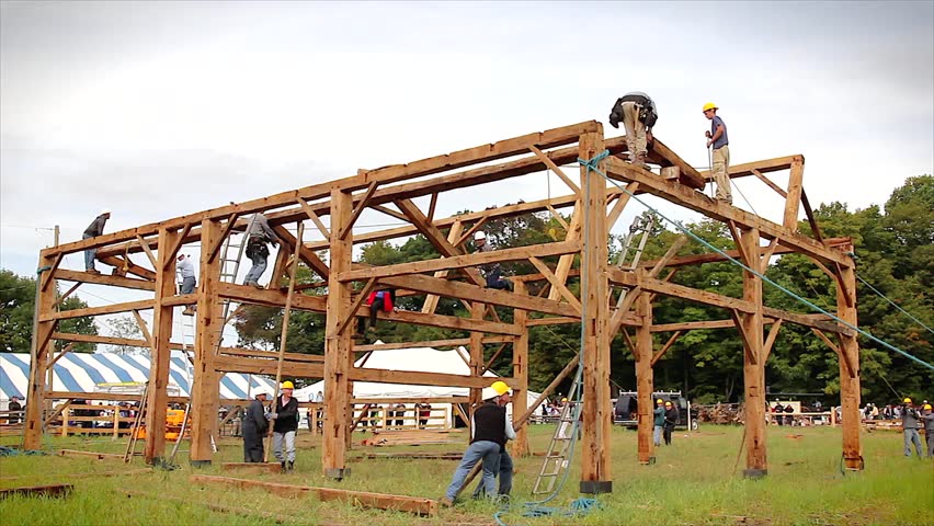 WATERLOO, ONTARIO - SEPTEMBER 21: Local Amish people traditionally raise a barn on September 21, 2012 in Waterloo, Ontario. This is a time lapse of a purlin being erected into place.