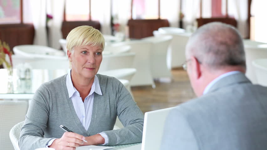 Mature businesswoman listening attentively to an applicant for a vacant position