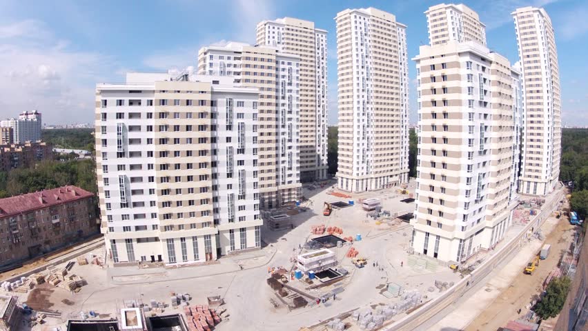 MOSCOW - AUG 6: (Timelapse View) Builders go on building site of housing estate Ekopark Elk Island (Losiniy Ostrov), on Aug 6, 2012 in Moscow, Russia