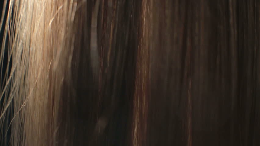 Combing long hair closeup