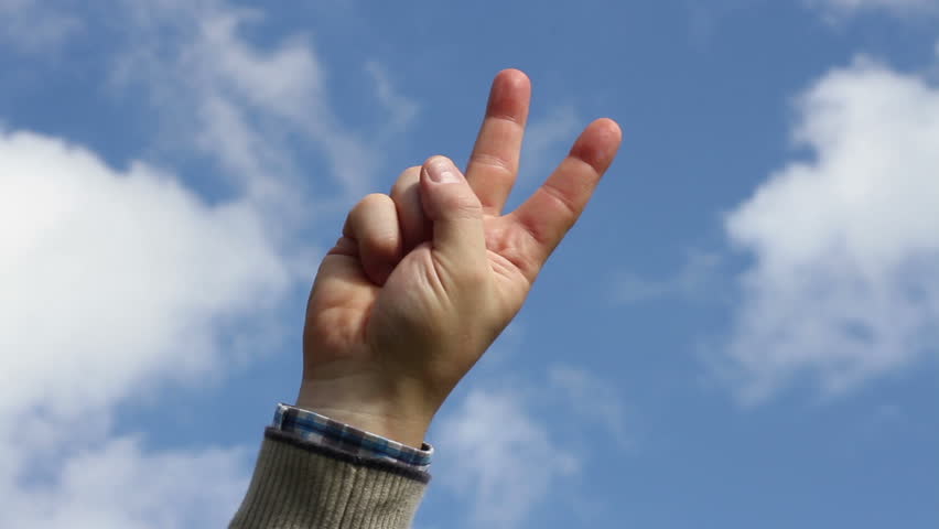 Man who makes the gesture of victory
