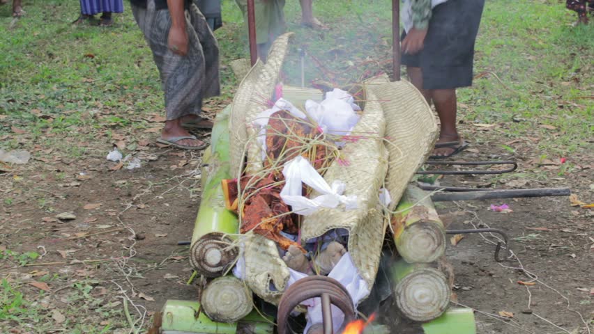 burning dead body in Balinese funeral, Bali, Indonesia