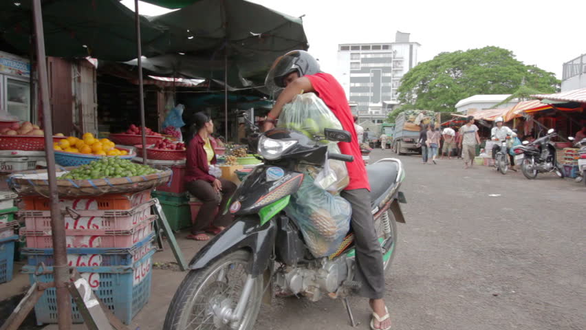 PHNOM PENH - JUNE 2012: local asian market with view of scooters