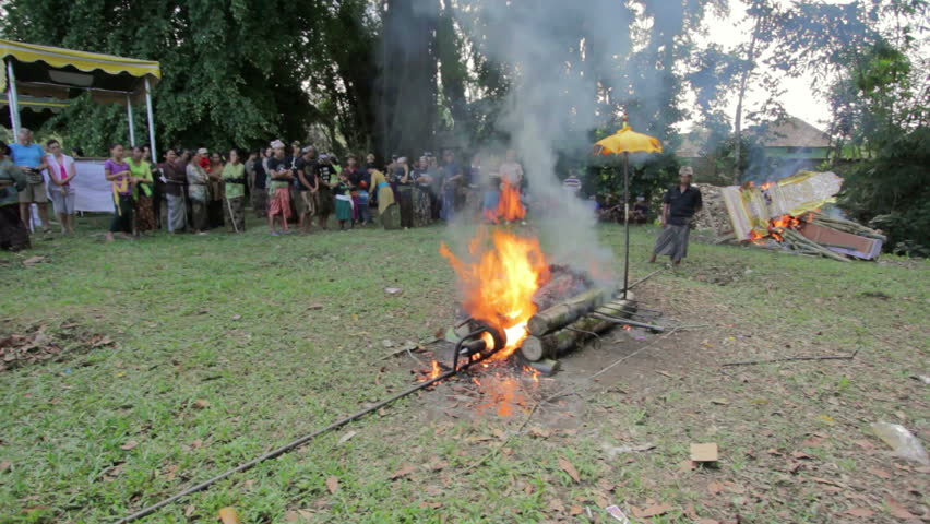 BALI - MAY 2012: burning dead body in balinese funeral