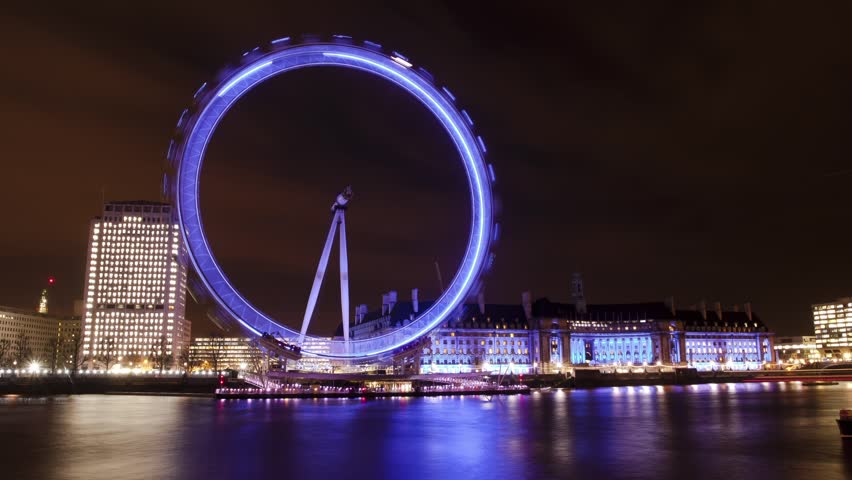LONDON - CIRCA 2012:  Time lapse of the London Eye at night in London circa 2012.