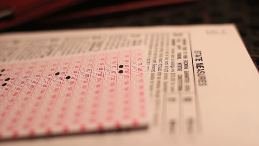Voter Filling Out Election Ballot in Close-Up