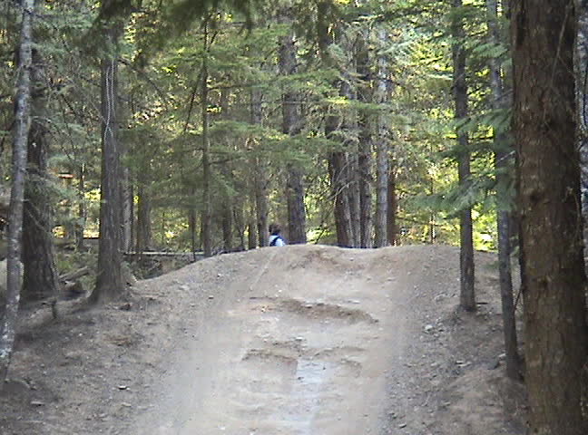 Bike jumping sequence on A-line trail at Whistler, B.C.