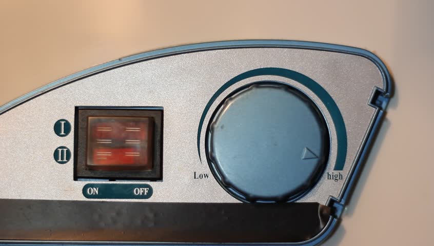 Water temperature controls on a hot water heater, twist hand.