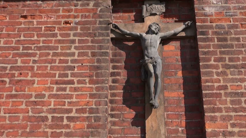 crucifix on old red brinks church wall