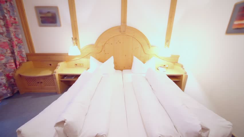 Hotel room with beds and other furniture, around motion