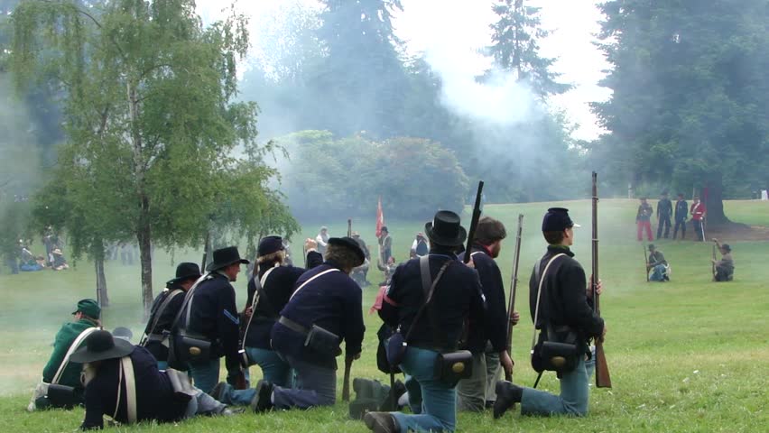 PORT GAMBLE, WA - JUN 20 - 	Union infantry kneels and fires a volley		in a mock battle at Port Gamble WA on Jun 20, 2009.
