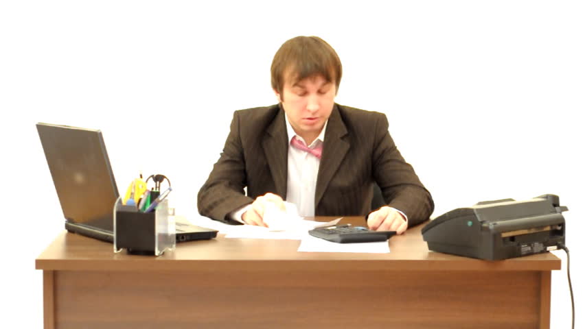 Businessman under stress at work sitting at table on white background HD