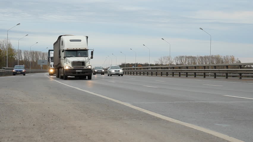 Cars and trucks on highway in Russia