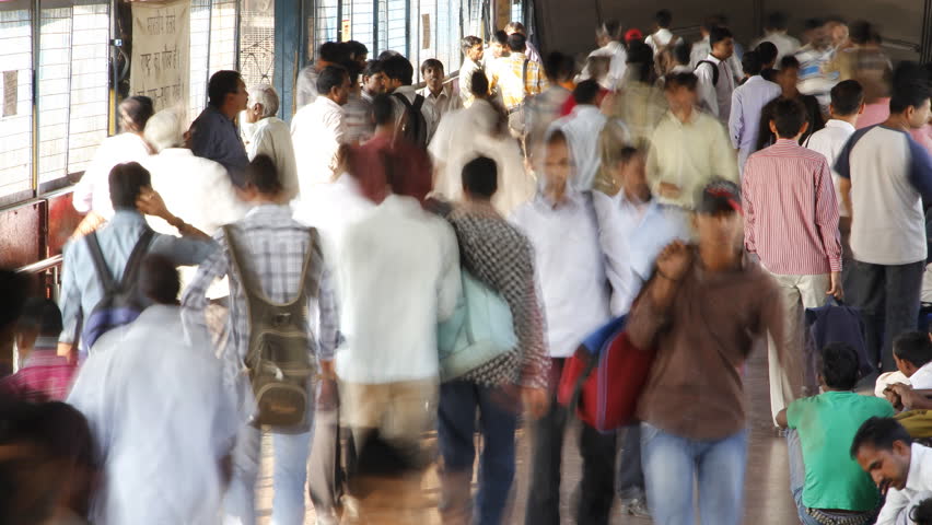 DELHI, INDIA - OCTOBER 1: Time lapse of huge crowds of people walk on the way to Delhi train station or Delhi railway station on October 1, 2012 in Delhi, India.