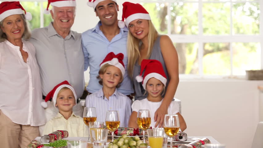 Happy family posing for photograph at christmas time