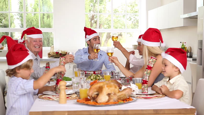 Happy family celebrating christmas at the dinner table